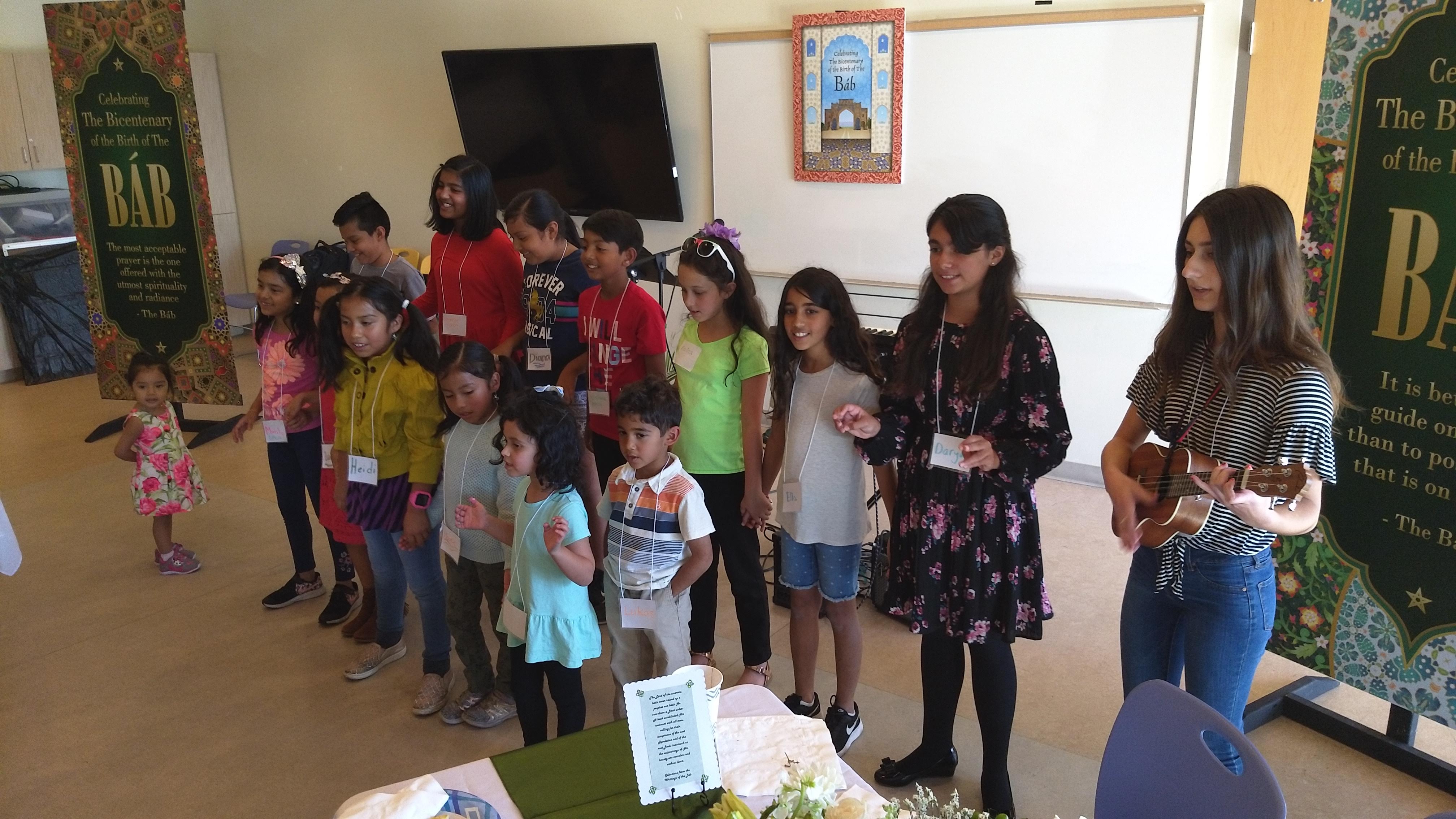 Children singing at the Bicentenary of the Báb at Lake Forest Sports Park
